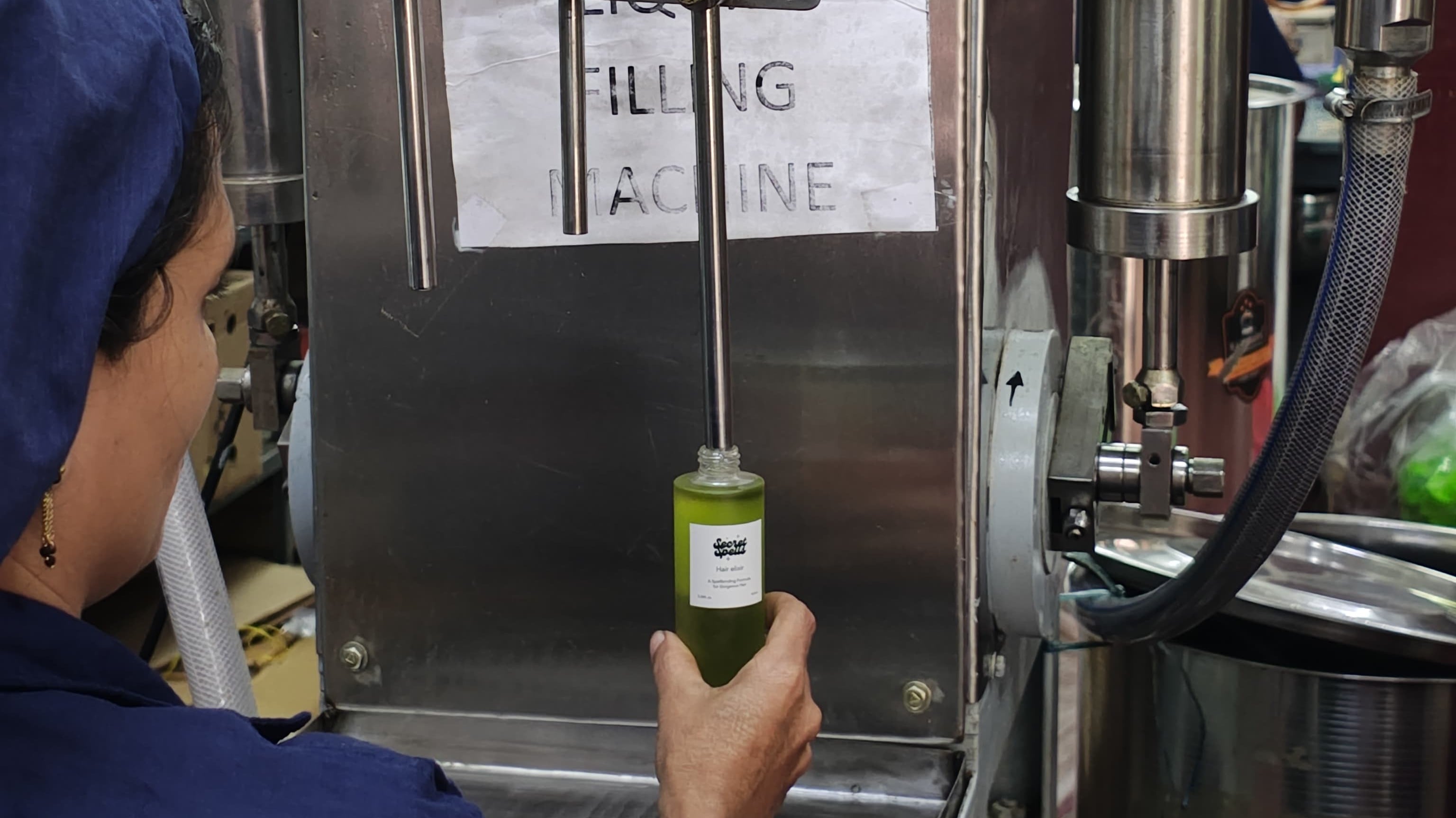 filling hair oil to bottles